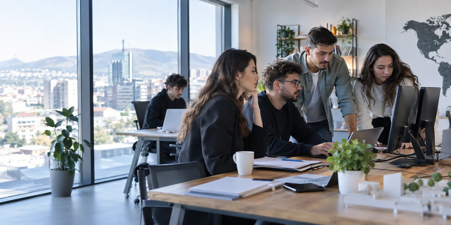People working at desks in an open-plan office